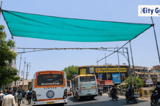 Rajkot Municipal Corporation’s Thoughtful Summer Initiative Shade Cover and Cooling Water Sprinklers at Trikon Baug Chowk Bring Relief to Citizens